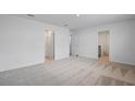 Bright bedroom with plush carpeting, ensuite bathroom, and walk-in closet at 3071 Birdsong Ave, Covington, GA 30016