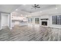 Bright living room with hardwood floors, a stone fireplace, and sliding glass doors at 6276 Willowbrook Dr, Riverdale, GA 30296