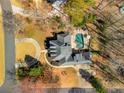 Aerial view of a home featuring a private backyard with a swimming pool and lush landscaping at 3345 Highgate Hills Ne Dr, Duluth, GA 30097