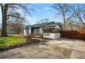 Charming brick home featuring a long driveway and stylish black-and-white trim at 884 N Eugenia Nw Pl, Atlanta, GA 30318