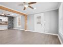 Bright and airy open-concept living area featuring modern flooring and stylish wooden beams at 884 N Eugenia Nw Pl, Atlanta, GA 30318