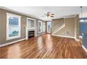 Inviting living room with hardwood floors and a cozy fireplace, perfect for relaxation at 185 Stayman Park, Fayetteville, GA 30215