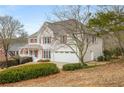 Attractive two-story home with a two-car garage and well-maintained landscaping at 2358 Alexander Farms Sw Ct, Marietta, GA 30064