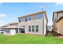 The exterior of a house that includes a covered patio and well-kept lawn at 2463 Turnbury Glen Walk, Snellville, GA 30078