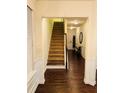 Welcoming foyer with hardwood floors and staircase to the upper level at 2463 Turnbury Glen, Snellville, GA 30078