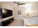 Relaxing media room with a comfortable couch, large flat screen tv and natural light at 1133 Church Se St # 2, Covington, GA 30014