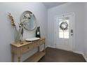 Welcoming foyer with dark wood floors and decorative accents at 5620 Berney Cir, Powder Springs, GA 30127
