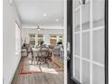 Inviting open-concept living space with natural light and hardwood floors throughout at 1733 Hyssop Blvd, Mableton, GA 30126