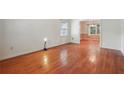 Spacious living room featuring gleaming hardwood floors and natural light at 6565 Katie Ln, Morrow, GA 30260