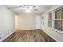 Bright living room with modern wood floors, ceiling fan, and window blinds at 1826 Meadowglades Dr, Decatur, GA 30035