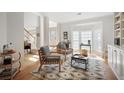 Inviting living room with a large bay window, stylish decor, and hardwood flooring, great for relaxing at 685 Trailwood Sw Ln, Marietta, GA 30064