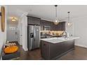 Modern kitchen with stainless steel appliances and a large center island at 495 Woodlawn Ave, Atlanta, GA 30318