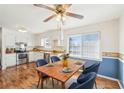 Cozy eat-in kitchen features a wood table, blue chairs and a stainless steel oven at 80 Brownsville Ext., Powder Springs, GA 30127