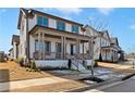 Elegant two-story house with a inviting front porch, set in a picturesque neighborhood setting at 1360 Flora Dr, Conyers, GA 30094