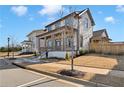 An elegant two-story home featuring a welcoming front porch, set in a picturesque neighborhood setting at 1360 Flora Dr, Conyers, GA 30094