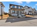 Beautiful two-story home featuring a welcoming front porch and landscaped front yard at 1360 Flora Dr, Conyers, GA 30094