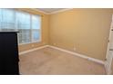 Bedroom with neutral paint, carpet floors, and natural light at 460 Chandler Bluff Ct, Grayson, GA 30017