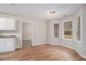 Cozy dining area with natural light, modern flooring, and access to the kitchen, perfect for meals at 100 Hunters Keep Trce, Covington, GA 30014