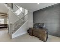 Foyer view with staircase, adjacent office area, and modern wall design at 2905 Ivy Mill Drive Dr, Buford, GA 30519