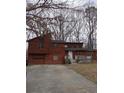 Charming two-story home with a wooden deck, garage and paved driveway at 805 Wayside Dr, Lawrenceville, GA 30046