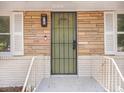 Close-up of the front door featuring a decorative security gate and brick accents at 2959 Meadowview Se Dr, Atlanta, GA 30316