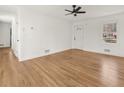 Spacious living room featuring hardwood floors, ceiling fan and white painted walls at 2959 Meadowview Se Dr, Atlanta, GA 30316