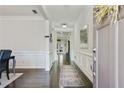 Inviting entryway with hardwood floors, decorative molding, and an open view into the home at 167 Marlow Dr, Woodstock, GA 30188