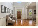 Inviting foyer with hardwood floors, high ceilings, natural light, and elegant decor at 2146 Wolbert Trl, Marietta, GA 30062