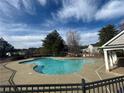 Sparkling community pool with lounge area, ideal for relaxation and recreation at 240 Village Square Dr, Woodstock, GA 30188