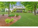 Beautiful home with a well-manicured lawn and inviting curb appeal at 1870 Shoreline Trce, Grayson, GA 30017