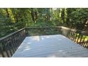 Spacious deck with gray wood and forest view at 409 Arbor Ridge Dr, Stone Mountain, GA 30087