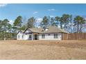 Attractive home with a welcoming entrance and well-manicured lawn at 1243 Old Villa Rica Rd, Dallas, GA 30157