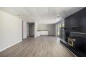 Finished basement featuring a fireplace, wet bar, and sliding glass doors at 2830 Jodeco Dr, Jonesboro, GA 30236