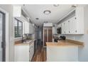 Kitchen with classic white cabinets, wood countertops, and modern appliances at 2830 Jodeco Dr, Jonesboro, GA 30236