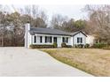 Inviting exterior view of a well-maintained home featuring a concrete driveway at 2172 Red Rose Ln, Loganville, GA 30052