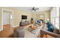 Open living area with wood flooring, ceiling fan, and neutral paint at 2703 Flagstone Se Dr, Atlanta, GA 30316