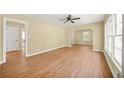 Spacious living room featuring hardwood floors, neutral walls and bright sunlight at 2703 Flagstone Se Dr, Atlanta, GA 30316