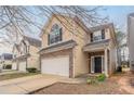 Two-story home featuring a brick facade, attached garage, and covered front porch at 11143 Aliyah Dr, Hampton, GA 30228
