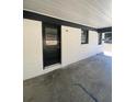 Carport with a clean, painted brick exterior and black trim, providing a sheltered parking space at 1808 Brewer Sw Blvd, Atlanta, GA 30310