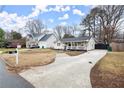 Quaint home nestled on a spacious lot with a long driveway and mature trees at 541 Benmac Se Rd, Smyrna, GA 30080