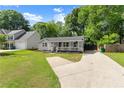 Charming single-story home with a welcoming front porch and a well-manicured lawn at 541 Benmac Se Rd, Smyrna, GA 30080