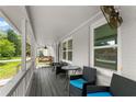 Inviting covered front porch featuring comfortable seating and a relaxing swing at 541 Benmac Se Rd, Smyrna, GA 30080