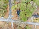 Aerial view of the home showcasing its position on a tree-lined street at 806 Longfellow Ct, Stone Mountain, GA 30088