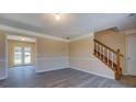 Open living area with hardwood floors and natural light at 105 Bentley Place Way, Covington, GA 30016