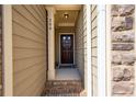 Inviting entryway with a stylish front door and a warm welcome sign at 209 Townview Dr, Woodstock, GA 30189