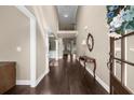 Elegant foyer with hardwood floors, soaring ceilings, and a view to the living spaces at 1605 Camden Cove Dr, Cumming, GA 30040