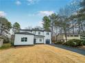 Modern two-story home with sleek design, an attached garage, and a well-manicured front lawn at 3444 Underwood Se Ct, Conyers, GA 30013