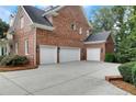Spacious three car garage with ample driveway space at 4992 Price Dr, Suwanee, GA 30024