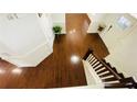 Elegant entryway showcasing hardwood floors, a staircase, and sophisticated trim work at 1159 Fort Marcy Park, Lawrenceville, GA 30044