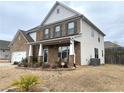 Lovely two-story home featuring a side entry garage, manicured landscaping, and a covered porch at 1159 Fort Marcy Park, Lawrenceville, GA 30044